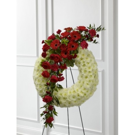 Traditional roses, daisies and carnation wreath.